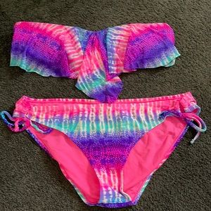 Multi colored bathing suit set. Top is large bottoms are extra large